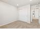 The bedroom features neutral carpet and a closet with sliding doors at 6531 N Malaya St, Aurora, CO 80019