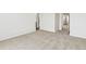 Neutral-toned bedroom with multiple doorways and plush carpet at 6531 N Malaya St, Aurora, CO 80019