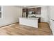 Stylish kitchen with granite countertops, stainless steel appliances, and wood-look floors at 6531 N Malaya St, Aurora, CO 80019