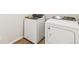 A laundry room features a white Whirlpool washer and dryer at 6531 N Malaya St, Aurora, CO 80019