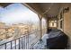 Covered balcony with snow, offering views of the neighborhood at 10587 Parkington Ln # B, Highlands Ranch, CO 80126