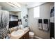Clean bathroom with a single sink vanity and shower/tub at 10587 Parkington Ln # B, Highlands Ranch, CO 80126