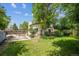 View of a large backyard with partial views of home and back patio area at 8552 Gray Ct, Arvada, CO 80003