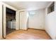 Finished basement room with laundry closet, laminate floors, and a small window at 8552 Gray Ct, Arvada, CO 80003