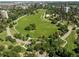 Breathtaking aerial view of a lush green park with winding paths, surrounded by urban landscape, offering a peaceful escape at 1401 N Franklin St # 1, Denver, CO 80218
