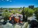Aerial view of a beautiful historic home in a leafy neighborhood with city views at 1401 N Franklin St # 1, Denver, CO 80218