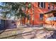 Inviting backyard space featuring a classic brick home and stone-paved patio, ideal for outdoor entertaining at 1401 N Franklin St # 1, Denver, CO 80218