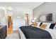 Comfortable bedroom showcasing ensuite bathroom and access to the hallway at 1401 N Franklin St # 1, Denver, CO 80218