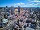 City neighborhood featuring rooftops, bare trees, and distant high-rise buildings at 1401 N Franklin St # 1, Denver, CO 80218