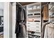 Well-organized closet with shelves, drawers, and hanging space for clothes and shoes at 1401 N Franklin St # 1, Denver, CO 80218