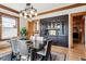 Stylish dining room featuring a dark wood table, updated lighting, and a charming built-in cabinet at 1401 N Franklin St # 1, Denver, CO 80218