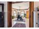 Dining room with wood trim, hardwood flooring, and natural light from large windows at 1401 N Franklin St # 1, Denver, CO 80218