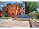 Exterior side view, showing brick facade, patio area and off street parking area at 1401 N Franklin St # 1, Denver, CO 80218