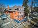 Unique three-story house boasting a bay window and distinct architectural details, surrounded by mature trees at 1401 N Franklin St # 1, Denver, CO 80218
