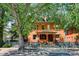 Charming brick home featuring a welcoming front porch and well-maintained blue fence at 1401 N Franklin St # 1, Denver, CO 80218
