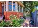 Charming brick home exterior with mature landscaping and a lovely stone pathway at 1401 N Franklin St # 1, Denver, CO 80218