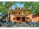 Beautiful red brick home with a covered porch and inviting curb appeal on a sunny day at 1401 N Franklin St # 1, Denver, CO 80218