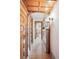 Charming hallway with original wood trim, hardwood floors, and a stylish cabinet with decorative lighting at 1401 N Franklin St # 1, Denver, CO 80218