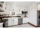 Efficient kitchen with white cabinets, stainless steel appliances, and light countertops at 1401 N Franklin St # 1, Denver, CO 80218