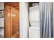 Convenient laundry area with a stacked washer and dryer and traditional style solid wood door at 1401 N Franklin St # 1, Denver, CO 80218
