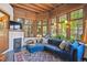 Inviting living room with hardwood ceilings, large windows, a fireplace and a comfortable blue sectional at 1401 N Franklin St # 1, Denver, CO 80218