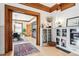 Open living room boasts hardwood floors, detailed trim, and built-in cabinets, seamlessly connecting to the dining area at 1401 N Franklin St # 1, Denver, CO 80218
