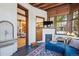 Cozy living room featuring a fireplace, TV, blue sectional sofa, and stylish accents at 1401 N Franklin St # 1, Denver, CO 80218