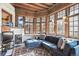 Cozy sun room featuring wood trim, large windows, comfortable seating, and tiled flooring at 1401 N Franklin St # 1, Denver, CO 80218