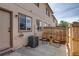 Cozy backyard patio area with a wooden fence, perfect for relaxing in a private outdoor space at 2642 Devonshire Ct, Denver, CO 80229