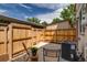 Private fenced backyard featuring a patio area, ideal for outdoor relaxation and entertainment at 2642 Devonshire Ct, Denver, CO 80229