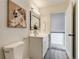 Bathroom showcasing modern fixtures, vanity, and art piece at 2642 Devonshire Ct, Denver, CO 80229