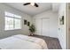 Well-lit bedroom with a fan, window and closet at 2642 Devonshire Ct, Denver, CO 80229