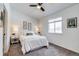 This cozy bedroom features a comfortable bed, nightstands, and a bright window, offering a relaxing retreat at 2642 Devonshire Ct, Denver, CO 80229