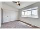 Bedroom featuring a ceiling fan, closet, and natural light at 2642 Devonshire Ct, Denver, CO 80229