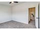 Bedroom showcasing carpeted floors and nearby bathroom at 2642 Devonshire Ct, Denver, CO 80229