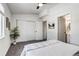 Bright bedroom boasts natural light, ceiling fan, and ensuite bathroom access at 2642 Devonshire Ct, Denver, CO 80229