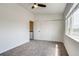 Bedroom featuring carpeted floors, closet space, and natural light at 2642 Devonshire Ct, Denver, CO 80229