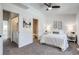 This comfortable bedroom features a view into the laundry room and the Primary bathroom at 2642 Devonshire Ct, Denver, CO 80229
