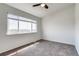 Bedroom highlighting carpeted floors, ceiling fan, and natural light at 2642 Devonshire Ct, Denver, CO 80229