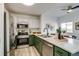 Bright, updated kitchen featuring stainless steel appliances and an open floor plan at 2642 Devonshire Ct, Denver, CO 80229