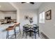 Kitchen with bar seating, open to the dining area and natural light from the window at 2642 Devonshire Ct, Denver, CO 80229