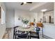 Open kitchen and dining area showcasing a breakfast bar and seating around a round table at 2642 Devonshire Ct, Denver, CO 80229