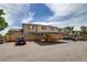 Townhome exterior featuring carports and ample parking space for residents and guests at 2642 Devonshire Ct, Denver, CO 80229