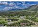 Scenic aerial view showcases houses nestled amongst the beautiful mountain landscape at 18376 Heavens Pl, Monument, CO 80132