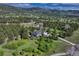 Aerial view showcasing home, landscaping, and panoramic mountain backdrop at 18376 Heavens Pl, Monument, CO 80132