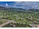 Scenic aerial view showcases houses nestled amongst the beautiful green landscape at 18376 Heavens Pl, Monument, CO 80132