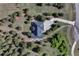 Overhead view of home showing landscaping, long driveway and surrounding trees at 18376 Heavens Pl, Monument, CO 80132