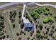 Stunning aerial view of home showing driveway and treed lot at 18376 Heavens Pl, Monument, CO 80132