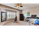 Bright home gym with large mirror and large window with backyard view at 18376 Heavens Pl, Monument, CO 80132