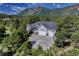 Stunning home featuring a three-car garage, large driveway, and mountain views at 18376 Heavens Pl, Monument, CO 80132